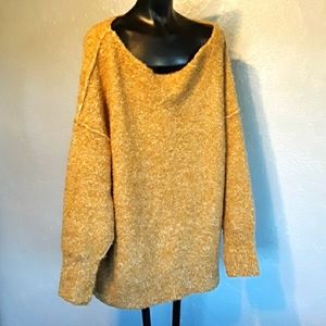 Free people sweater acrylic and a little wool size medium but really large